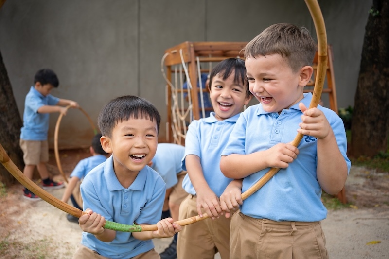 Pre-Prep children playing with hoops outdoors