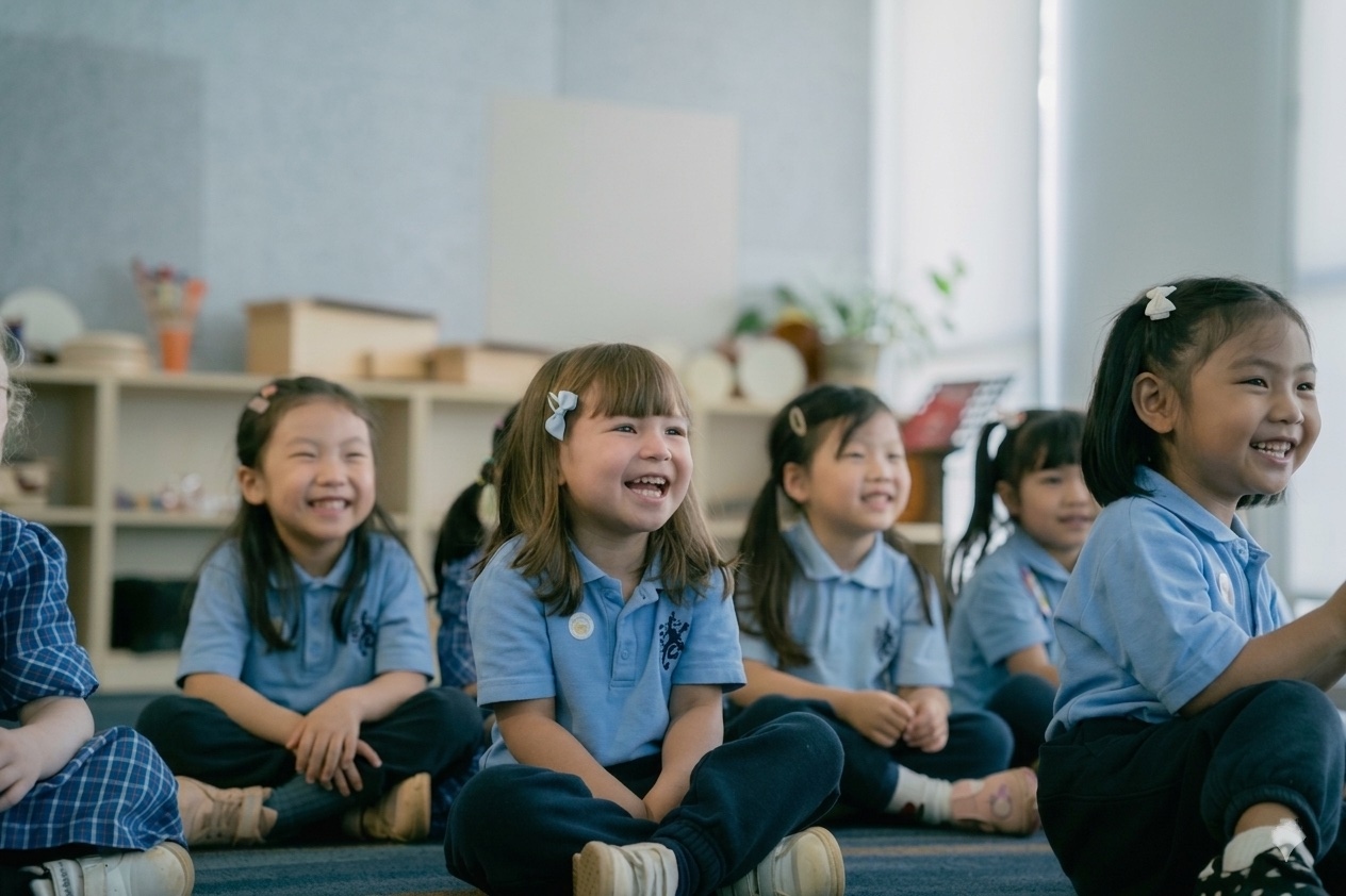 Pre-Prep children sitting together and laughing during circle time